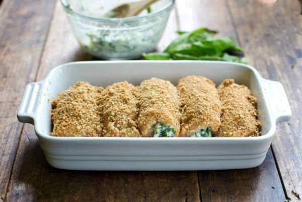 Baked Mozzarella Chicken Rolls in a white baking dish.