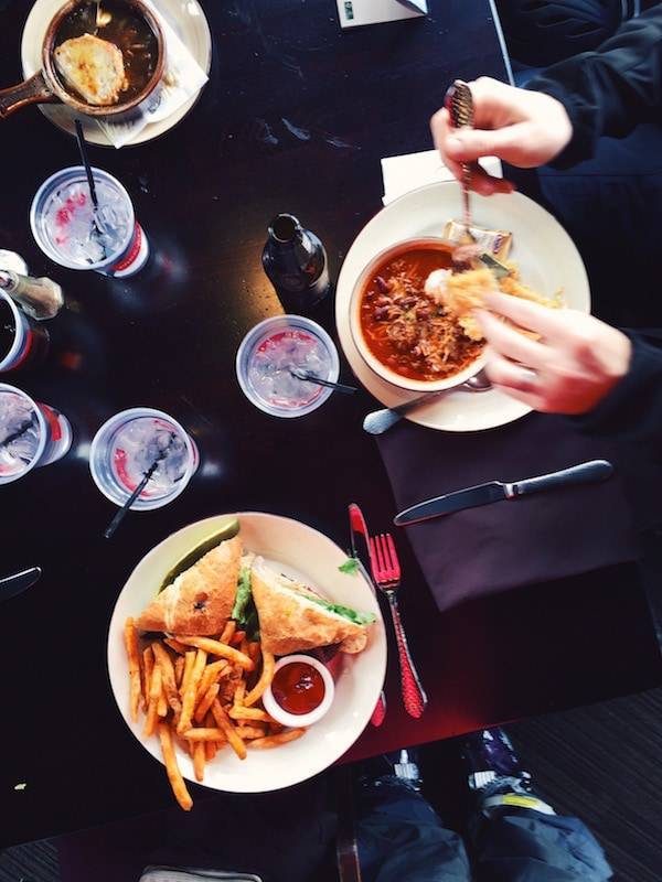 Table with plates of food.