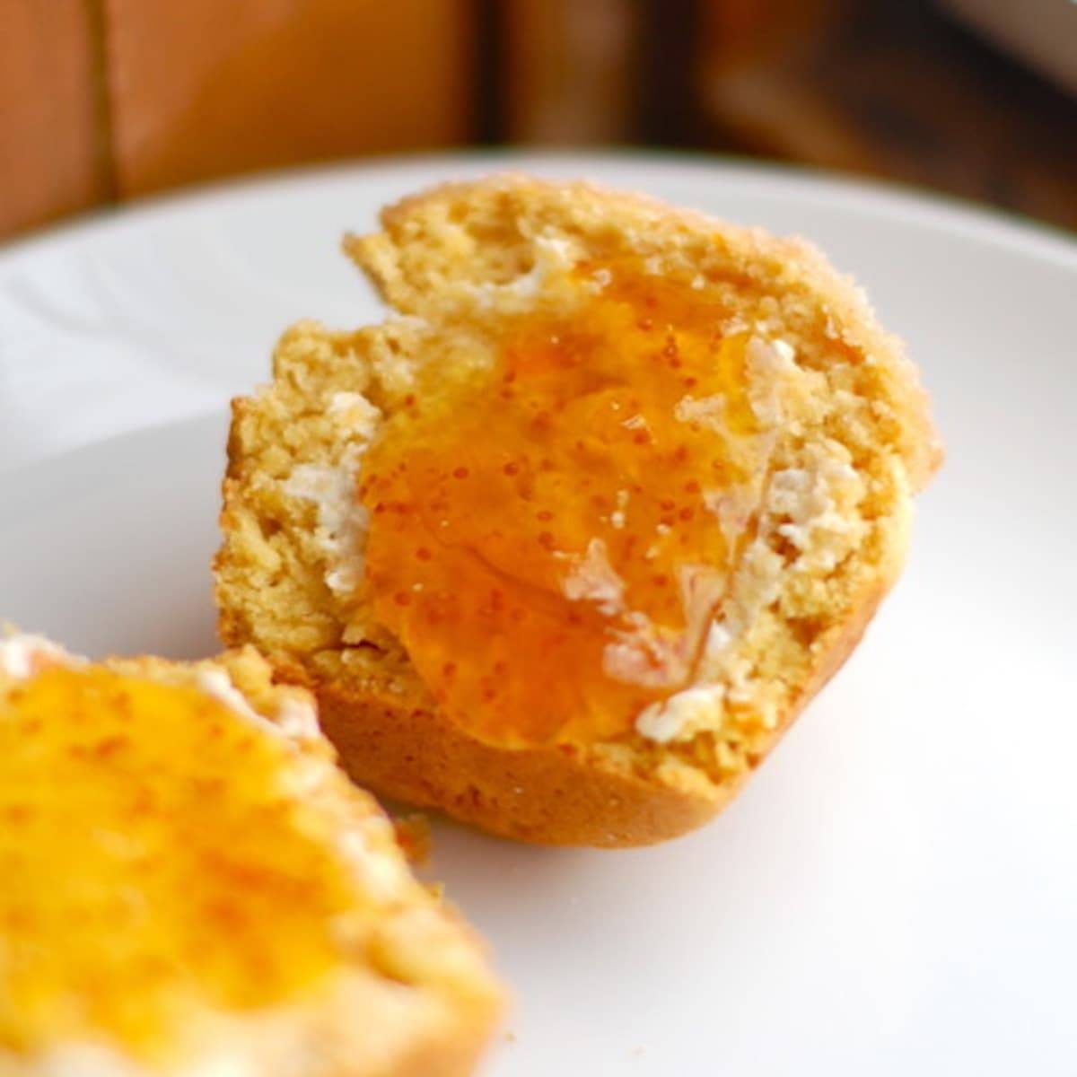 Sugar-dusted sweet potato muffins with fruit preserves.