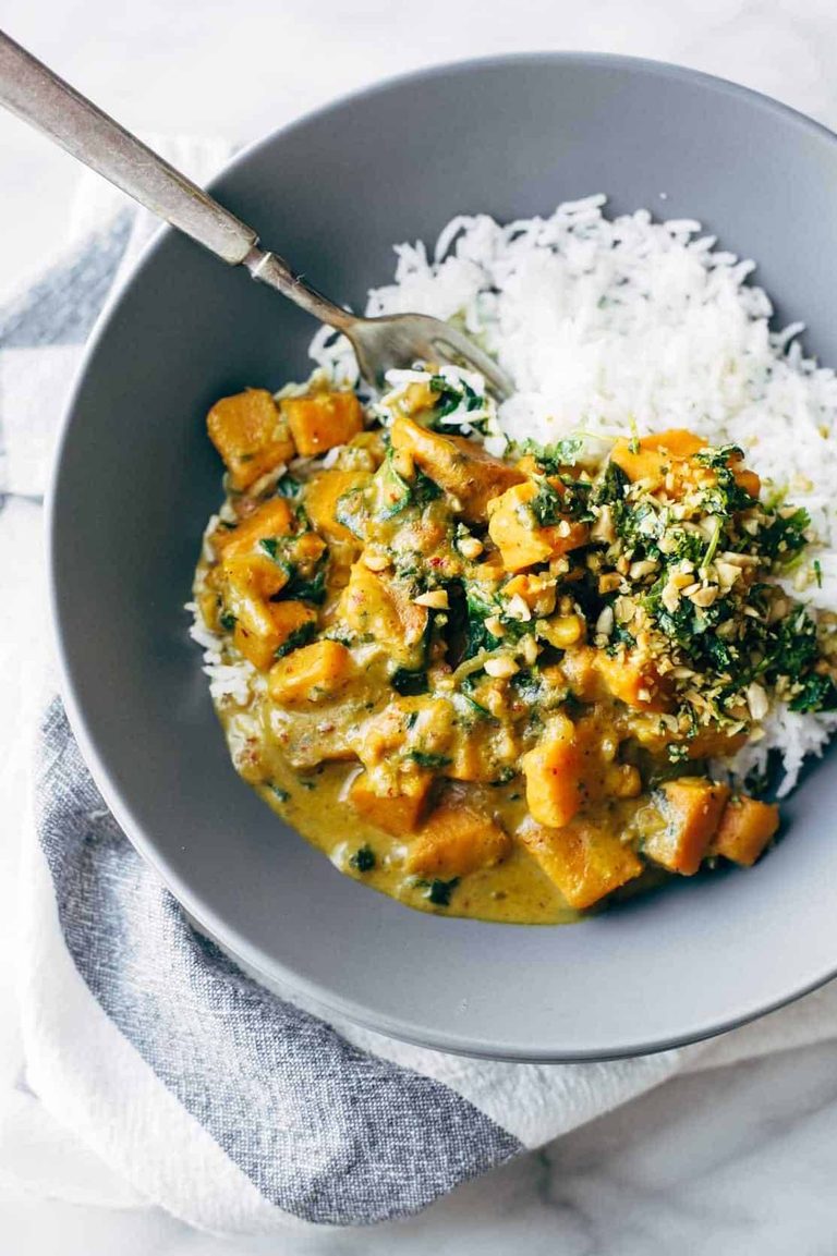 Thai sweet potato curry in a bowl with rice.