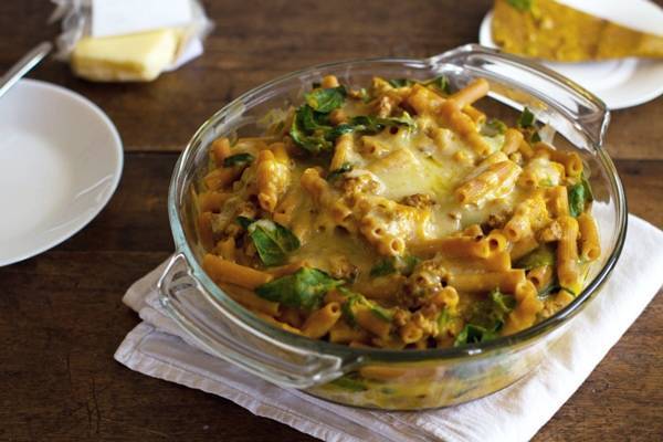 Baked rigatoni in a clear bowl.