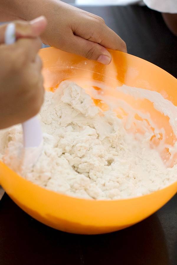 Dough in an orange bowl.