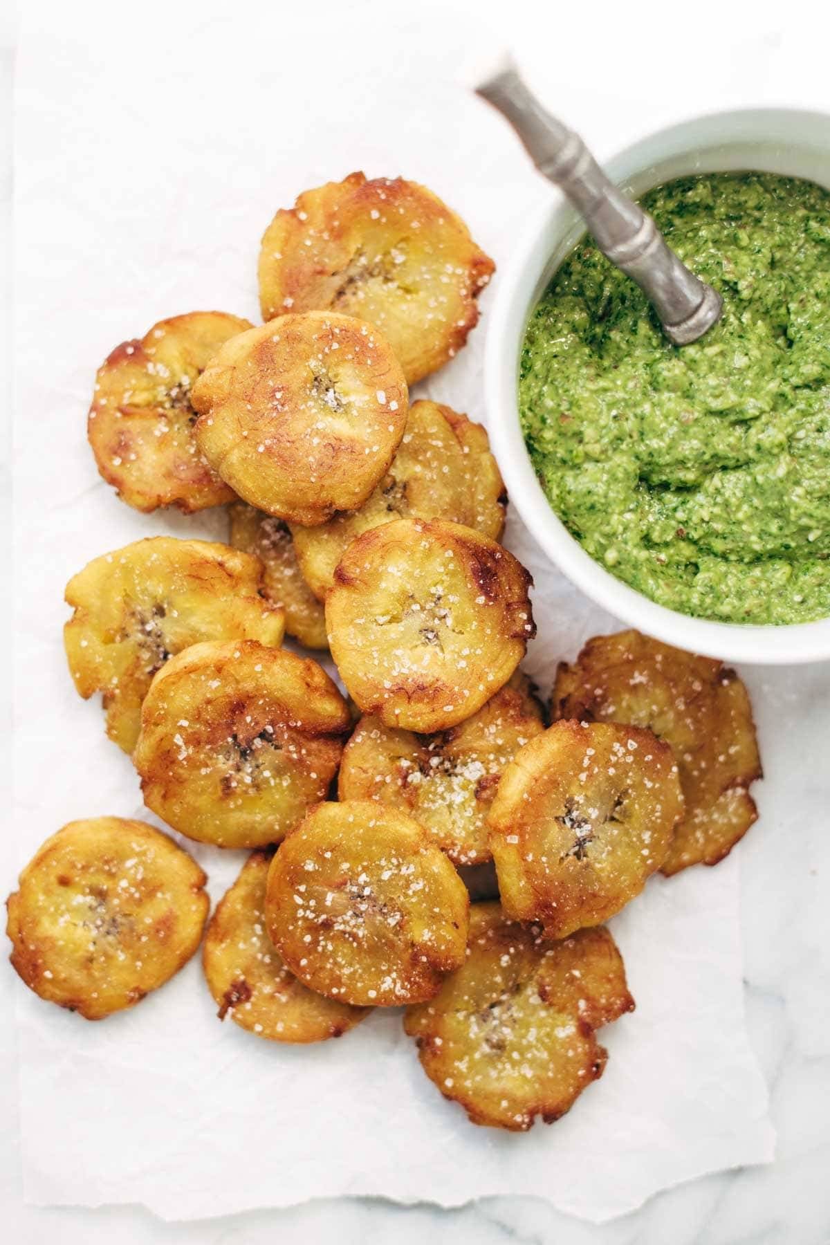 Crispy Salted Tostones - super easy recipe for golden brown bites of perfection with just one ingredient: PLANTAINS! video demo in the post. | pinchofyum.com
