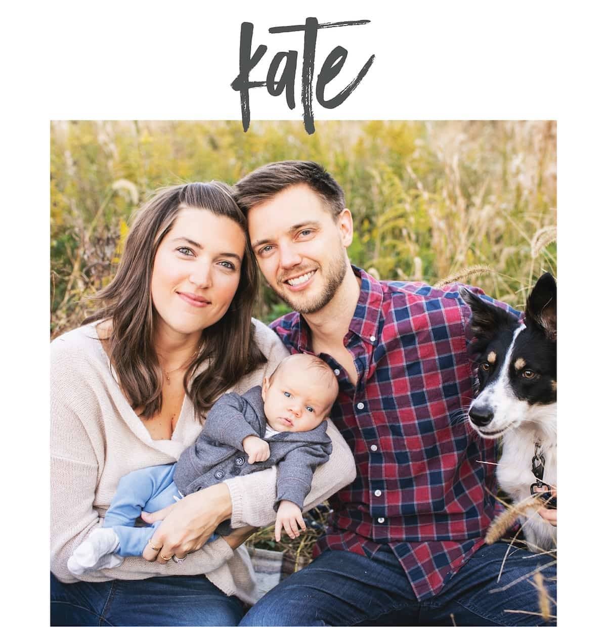 A man and a woman together with a baby and a dog.