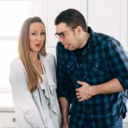 Lindsay and Bjork making silly faces in their kitchen.