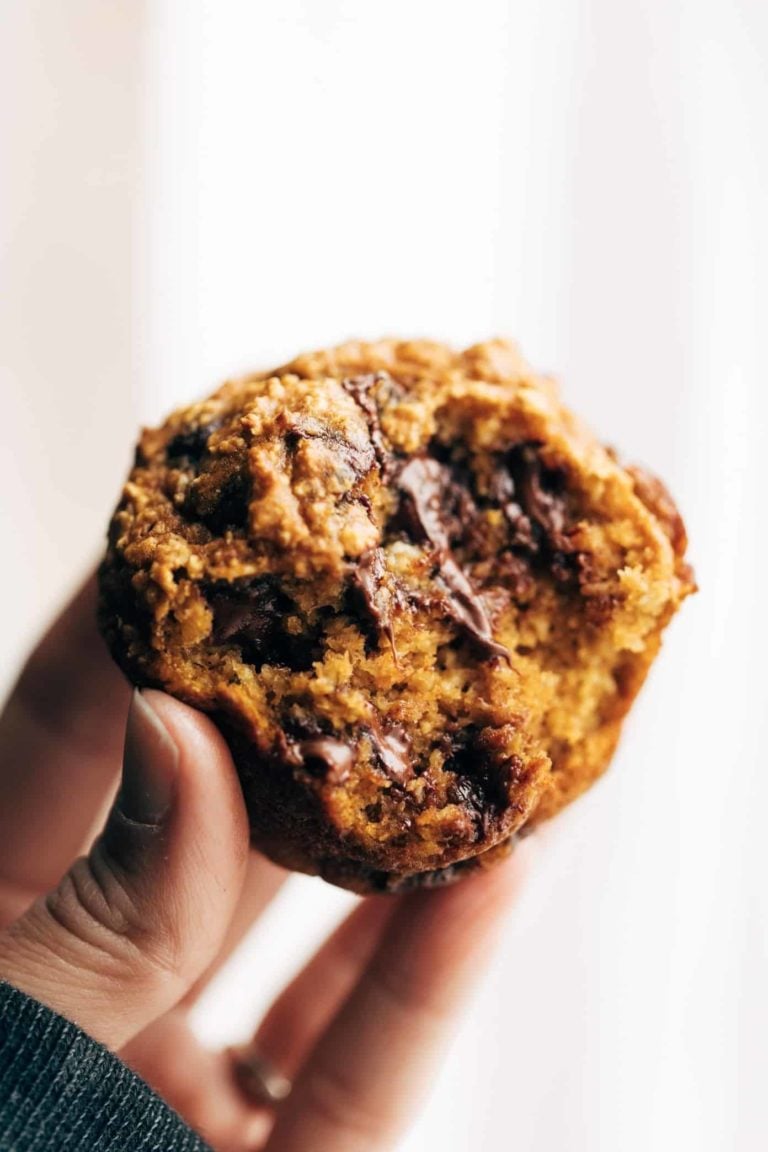 A half-bitten pumpkin muffin.