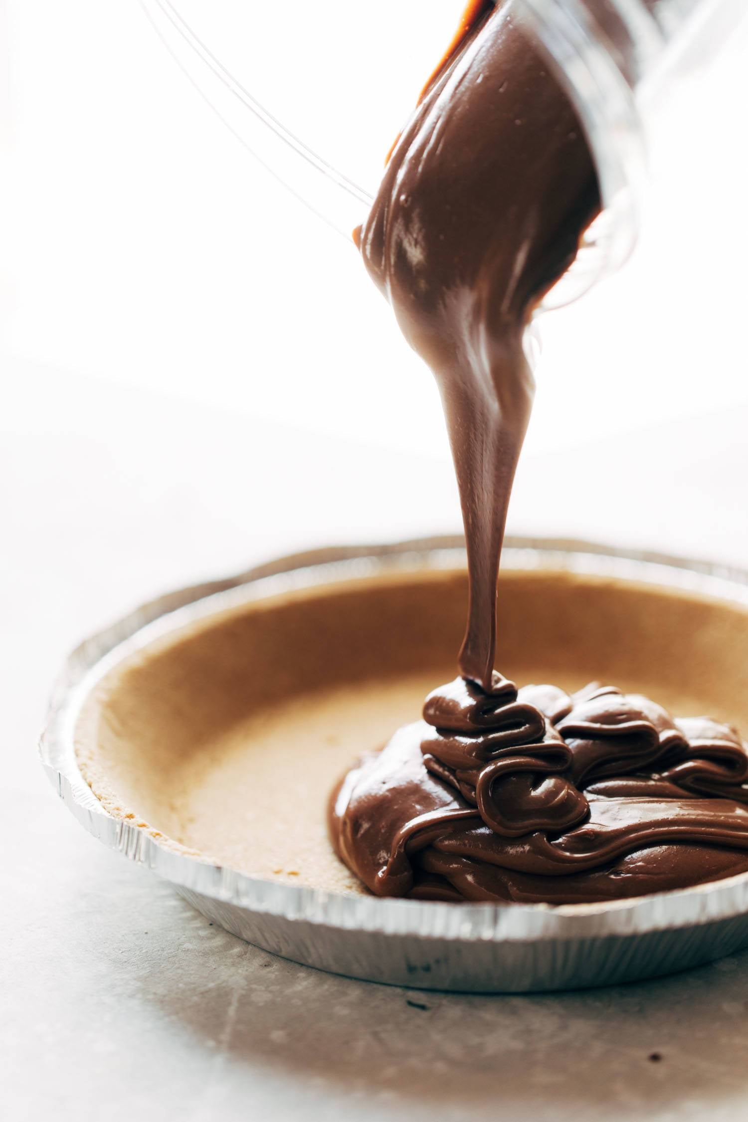 This no-bake vegan chocolate pie only requires five ingredients! Kinda like a French Silk Pie, but better for you. Vegan / Dairy Free / Gluten Free | pinchofyum.com